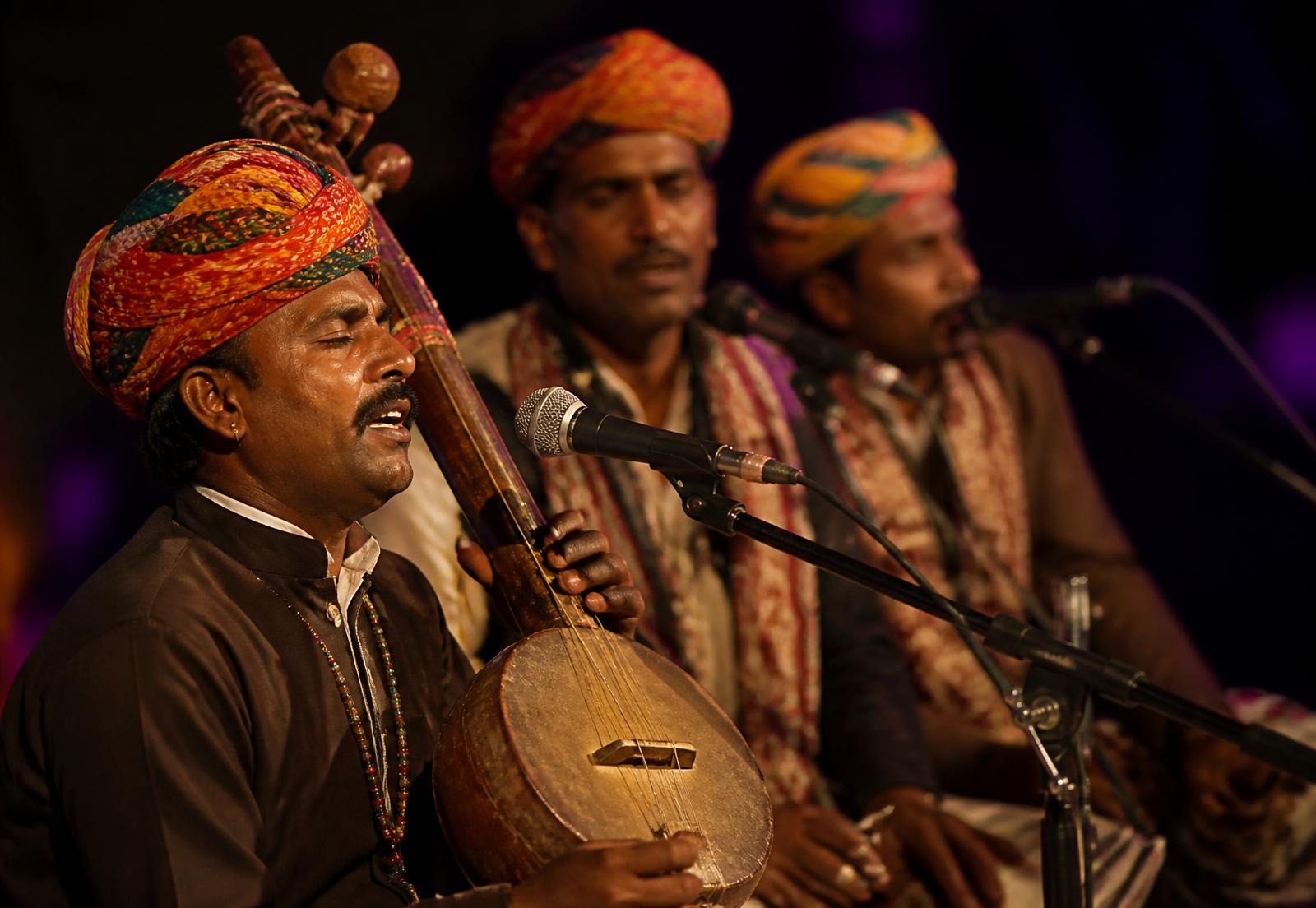 Manganiyar musicians performing in the Rajasthan desert at dusk